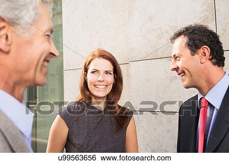 Stock Photograph - Business people talking outdoors. Fotosearch