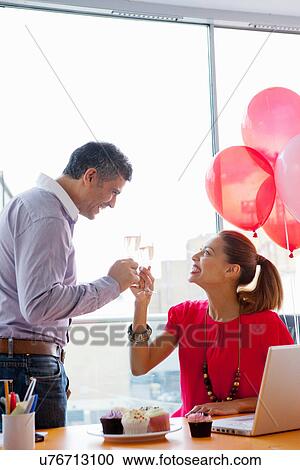 Business people toasting at office party View Large Photo Image Stock Image - Business people toasting at office party. Fotosearch