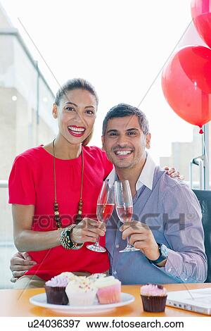 Stock Photo - Business people toasting at office party. Fotosearch