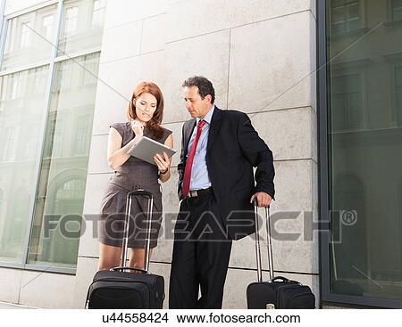 Business people using tablet computer View Large Photo Image Picture - Business people using tablet computer. Fotosearch