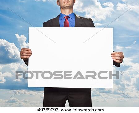 Businessman holding blank card View Large Photo Image Stock Image - Businessman holding blank card. Fotosearch