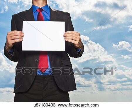 Businessman holding blank card View Large Photo Image Stock Image - Businessman holding blank card. Fotosearch