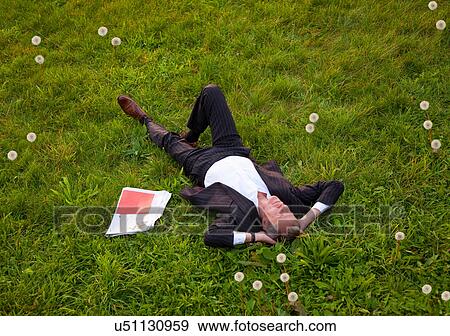 Businessman relaxing in park View Large Photo Image Stock Photo - Businessman relaxing in park. Fotosearch