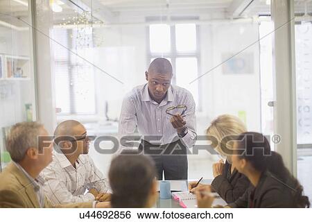 Stock Photograph - Businessman talking in meeting. Fotosearch