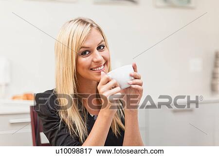 Businesswoman having cup of coffee View Large Photo Image Stock Photo - Businesswoman having cup of coffee. Fotosearch