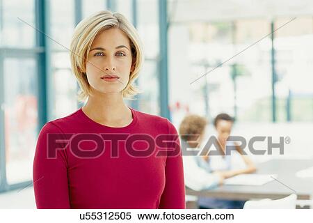 Stock Photography - Businesswoman standing in office. Fotosearch