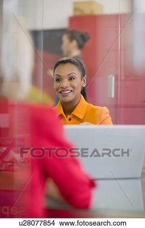 Businesswoman talking in meeting View Large Photo Image Picture - Businesswoman talking in meeting. Fotosearch