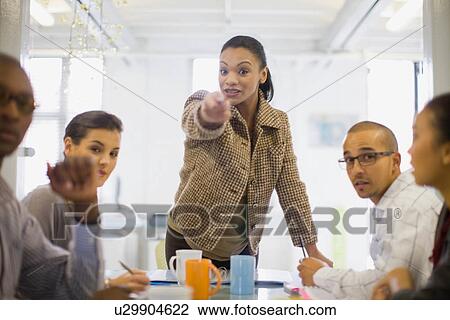 Stock Image - Businesswoman talking in meeting. Fotosearch