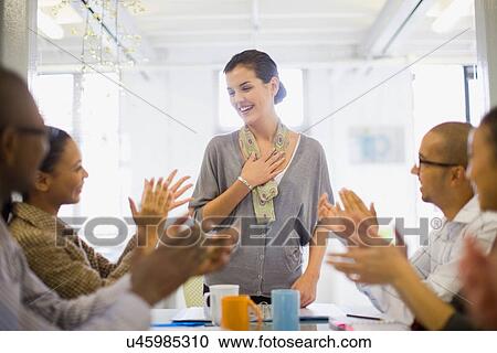 Stock Image - Businesswoman talking in meeting. Fotosearch