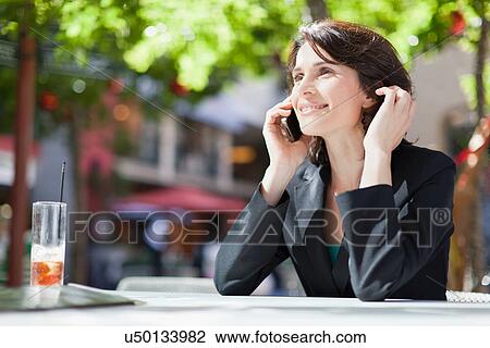 Businesswoman talking on cell phone View Large Photo Image Stock Image - Businesswoman talking on cell phone. Fotosearch