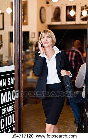Businesswoman talking on cell phone View Large Photo Image Stock Image - Businesswoman talking on cell phone. Fotosearch
