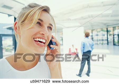 Businesswoman talking on cell phone View Large Photo Image Stock Photo - Businesswoman talking on cell phone. Fotosearch