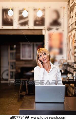 Businesswoman working in cafe View Large Photo Image Stock Photo - Businesswoman working in cafe. Fotosearch