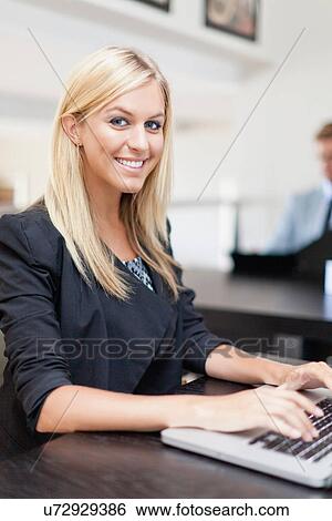 Stock Photograph - Businesswoman working on laptop. Fotosearch
