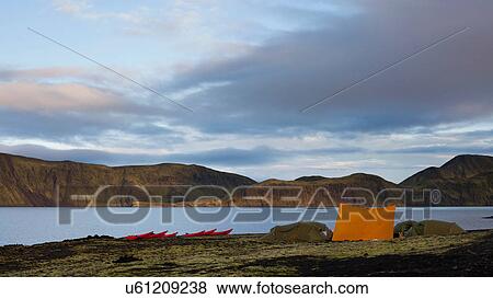 Canoes docked at campsite by lake View Large Photo Image Stock Photo - Canoes docked at campsite by lake. Fotosearch