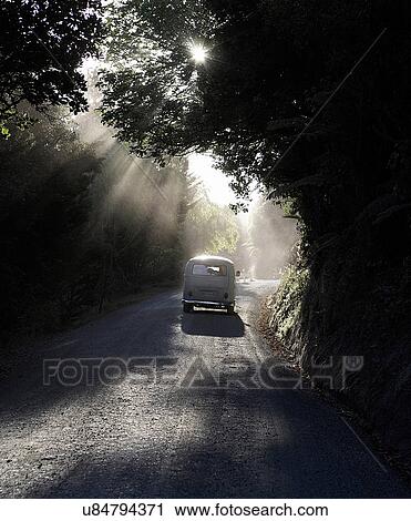 Car driving down rural road View Large Photo Image Stock Image - Car driving down rural road. Fotosearch