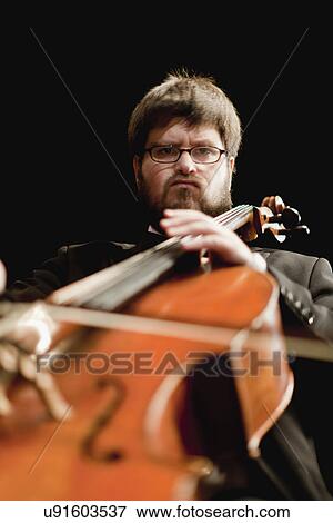 Cello player in orchestra View Large Photo Image Stock Photo - Cello player in orchestra. Fotosearch