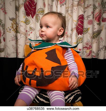 Child dressed as pumpkin for Halloween View Large Photo Image Stock Photography - Child dressed as pumpkin for Halloween. Fotosearch