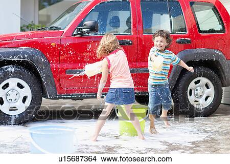 Children playing and washing car View Large Photo Image Picture - Children playing and washing car. Fotosearch