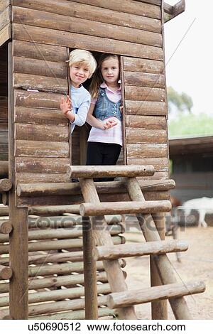 Children playing in playhouse View Large Photo Image Stock Image - Children playing in playhouse. Fotosearch