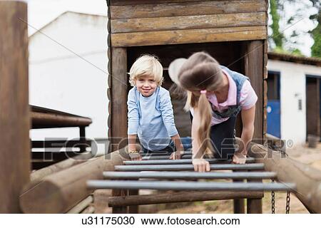 Children playing on monkey bars View Large Photo Image Stock Image - Children playing on monkey bars. Fotosearch