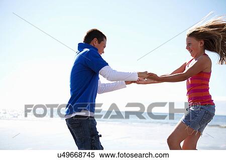 Children playing together on beach View Large Photo Image Stock Photography - Children playing together on beach. Fotosearch