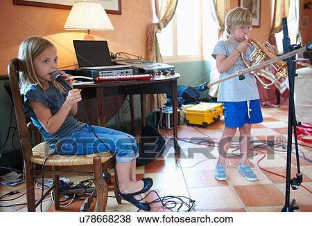 Children singing and playing music View Large Photo Image Stock Photo - Children singing and playing music. Fotosearch