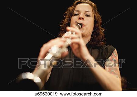 Stock Photo - Clarinet player in orchestra. Fotosearch