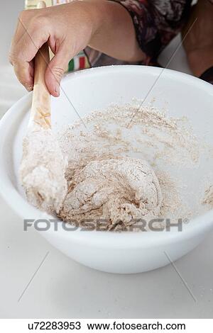 Close up of boy stirring dough in bowl View Large Photo Image Stock Image - Close up of boy stirring dough in bowl. Fotosearch