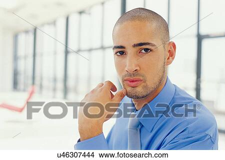Close up of businessman's face View Large Photo Image Picture - Close up of businessman's face. Fotosearch