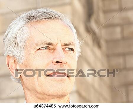 Close up of businessman's serious face View Large Photo Image Stock Photography - Close up of businessman's serious face. Fotosearch