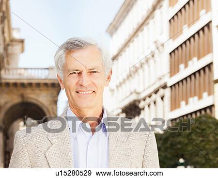 Stock Photo - Close up of businessman's smiling face. Fotosearch