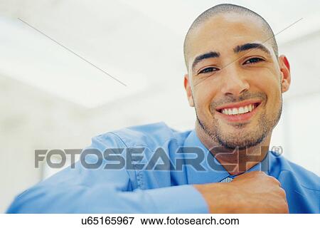 Close up of businessman's smiling face View Large Photo Image Stock Photo - Close up of businessman's smiling face. Fotosearch