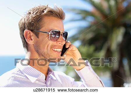 Stock Photography - Close up of businessman's smiling face. Fotosearch