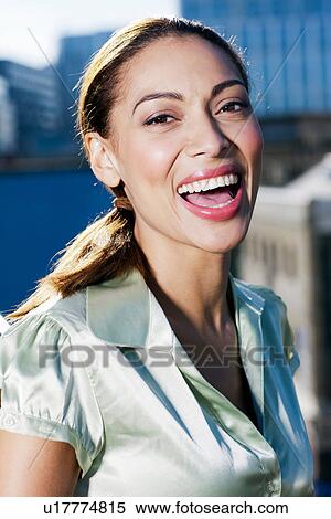Stock Photography - Close up of businesswoman laughing. Fotosearch