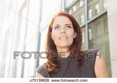 Stock Photograph - Close up of businesswoman's smiling face. Fotosearch
