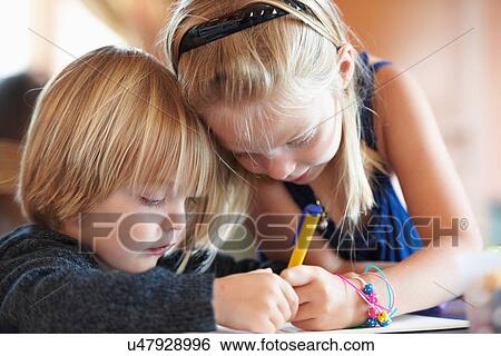Close up of children drawing indoors View Large Photo Image Stock Photograph - Close up of children drawing indoors. Fotosearch