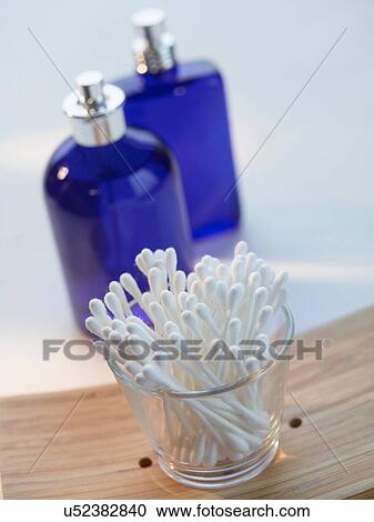 Close up of cotton buds and perfume View Large Photo Image Stock Image - Close up of cotton buds and perfume. Fotosearch