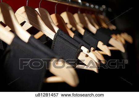 Close up of dresses on clothes hangers View Large Photo Image Stock Photo - Close up of dresses on clothes hangers. Fotosearch