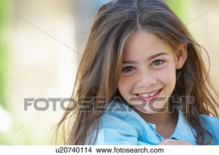 Picture - Close up of girl's smiling face. Fotosearch