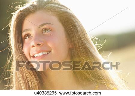 Stock Photography - Close up of girls smiling face. Fotosearch