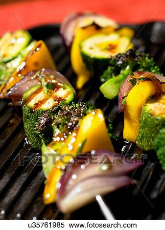Close up of grilled skewered vegetables View Large Photo Image Stock Photography - Close up of grilled skewered vegetables. Fotosearch