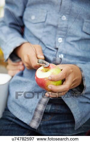 Close up of man peeling apple View Large Photo Image Stock Photo - Close up of man peeling apple. Fotosearch