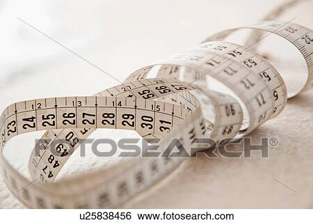 Stock Photograph - Close up of measuring tape. Fotosearch