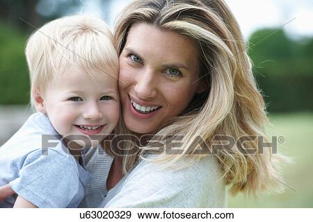 Stock Photo - Close up of mother and child smiling. Fotosearch