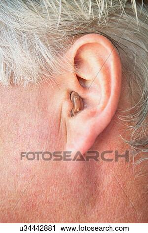 Close up of older person's hearing aid View Large Photo Image Stock Image - Close up of older person's hearing aid. Fotosearch