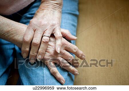 Close up of older woman's folded hands View Large Photo Image Stock Photo - Close up of older woman's folded hands. Fotosearch
