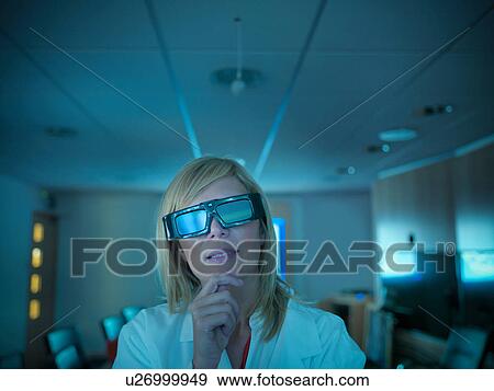 Close up of scientist wearing 3D glasses and looking at screen View Large Photo Image Stock Photo - Close up of scientist wearing 3D glasses and looking at screen. Fotosearch
