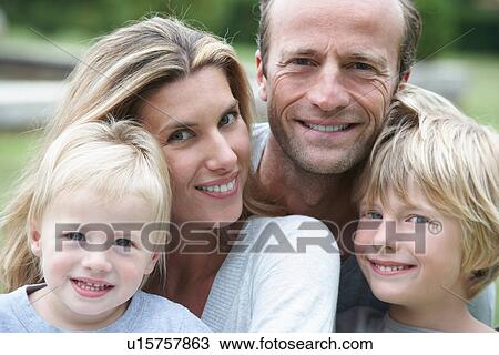 Stock Image - Close up of smiling family. Fotosearch