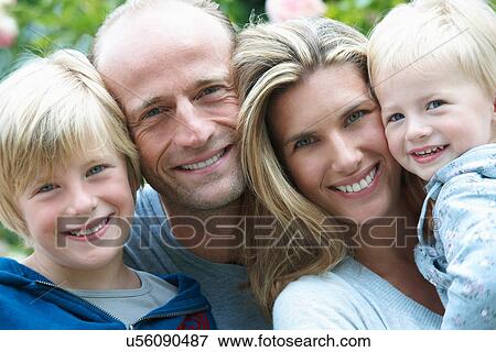 Close up of smiling family View Large Photo Image Stock Photo - Close up of smiling family. Fotosearch